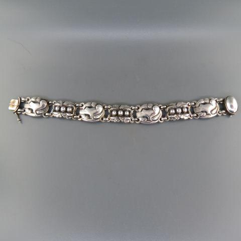 Georg Jensen Denmark Sterling Silver Bracelet,: bird, leaf and berry design links, 5/8" wide, 7 1/4" long, signed, #24, 30 grams......With a history that spans more than 100 years, the Georg Jensen brand represents quality craftsmanship and timeles