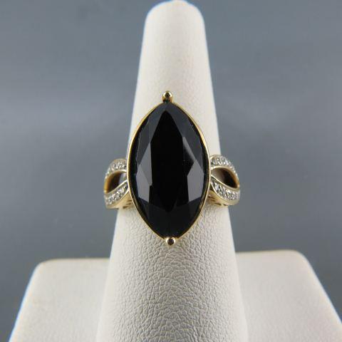 Diamond & Black Onyx Ring,: marquise shape onyx with 10 round diamonds on each side, 14K yellow gold, 4.3 grams, currently size 7.