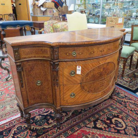 Italian Commode or Chest with fancy Inlay,: burl and carved trim, sunburst style inlay on top, three drawers, side doors, 57" wide, 23" deep, 36" tall.