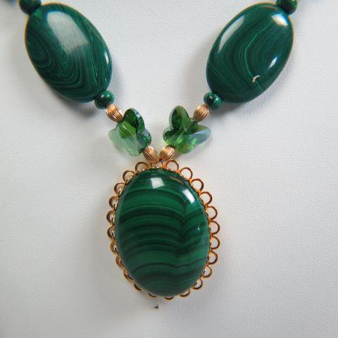 Malachite & 14K Gold Necklace,: oval double cabochon beads with yellow gold spacers and iridescent green Swarovski butterflies, 30" long, plus an added pendant.