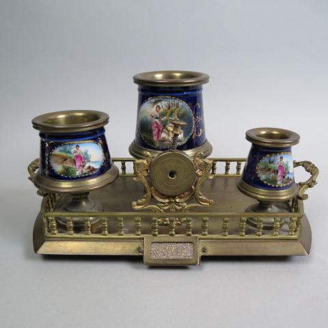 19th Century Bronze Smoking Companion Stand,: with place for cigars, cigar cutter, match holder and waste, striker on front, Royal Vienna style porcelain trim, gallery sides, handled, 12" across, 6 1/2" tall.