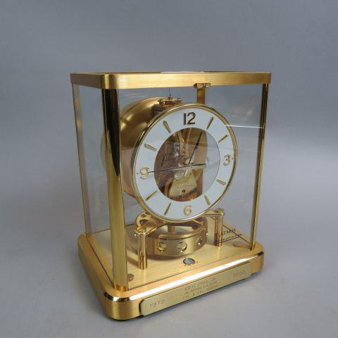 Jaeger-LeCoultre "Atmos" Clock,: 13 jewels, #540, a fine clean example of an atmospheric clock, 9" tall, drop front glass door, working.....Atmos is the brand name of a mechanical torsion pendulum clock manufactured by Jaeger-LeCoult