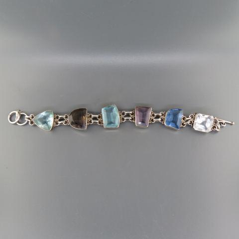 Sterling & Gemstone Bracelet,: various colors of mostly quartz, 39 grams, 8" long.