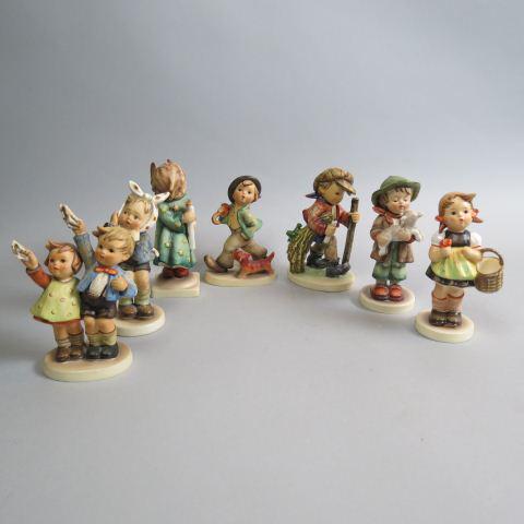 7 Hummel Figurines:: all different, most 5", one an old full bee mark, all excellent.
