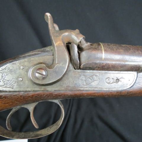 Double Barrel Percussion Shotgun, signed L.M.,: walnut, checkered at the wrist, 38" barrel, 54" long.