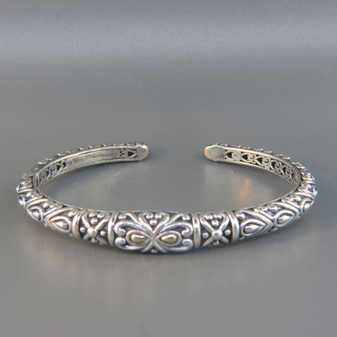 John Hardy 14K Gold & Sterling Bracelet,: fancy design cuff, 9mm at widest, hinged, 23.3 grams, signed...John Hardy is dedicated to creating artisan handcrafted jewelry. Each of John Hardy’s distinctive collections conveys evocative symboli