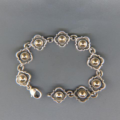 James Avery 14K Gold & Sterling Bracelet,: 9 floral stations each with 5.5 mm gold ball center, with links in between, 7" long, 32 grams, older discontinued design.