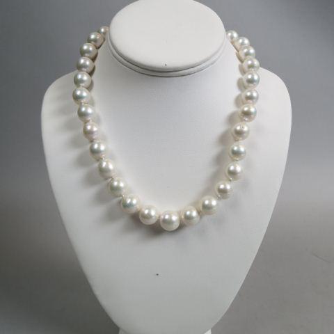Pearl Necklace,: 33 lustrous white pearls, 11.5 mm, pearl studded clasp, 18 1/2" long.