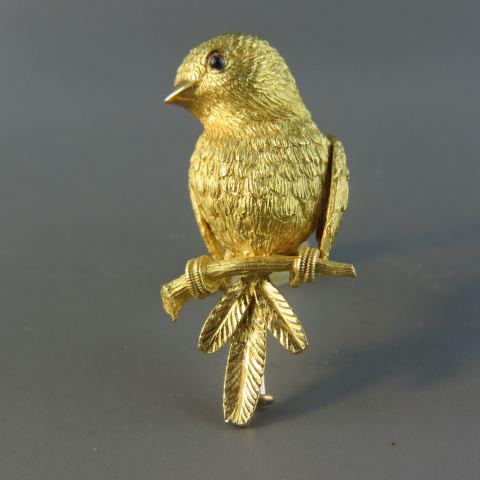Van Cleef & Arpels 18K Gold Bird Brooch,: figural bird on branch, fine textured finish, blue cabochon sapphire eyes, signed, hallmarked, numbered 121458, dress clip style, 1 1/2" long, excellent, in original VCA box, signed, numbered.