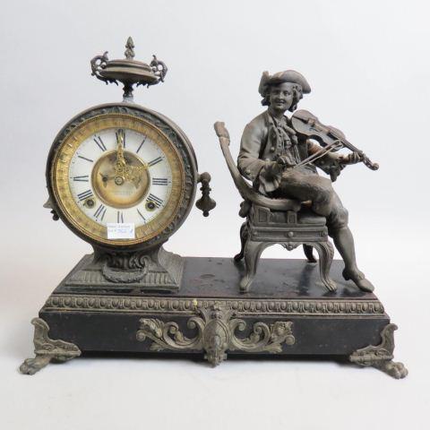 Ansonia Victorian Figural Mantle Clock,: bronzed seated man playing violin, metal base, 14" tall, 17" wide.