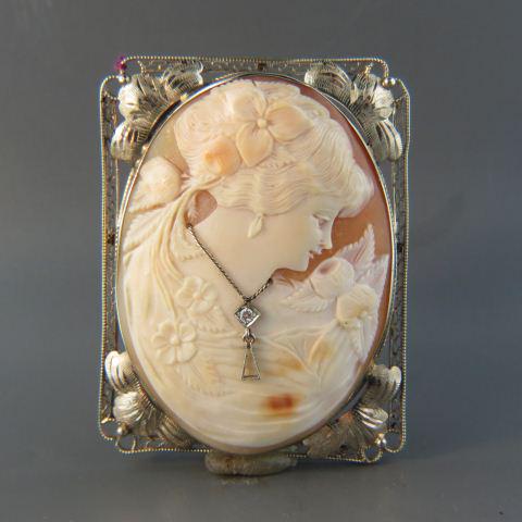 Large 14K Gold Cameo Brooch or Pendant,: young lady with flowers in her hair, wearing a diamond necklace, oval carved shell in 14K white gold, fancy filigree squared frame, overall 2 1/4" x 1 3/4", a beauty.