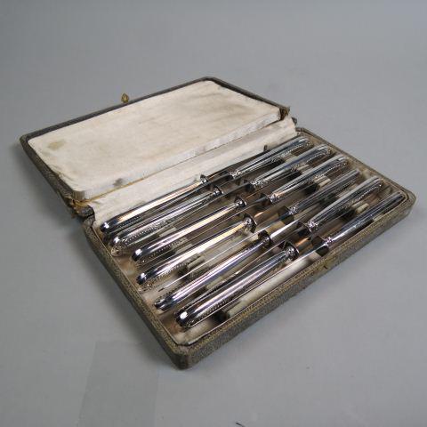 12 French Silver Dinner Knives in Original Box,: marked Paris on blade, fine pattern on handle, 10" long, excellent.