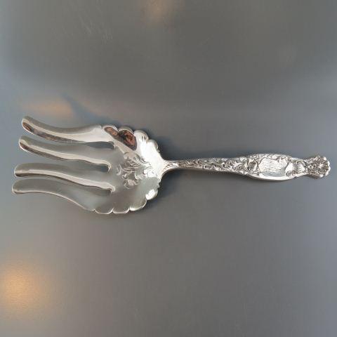 Whiting "Heraldic" Sterling Asparagus Server,: circa 1880, knight's helmet and fancy decor, 8 1/4" long, monogrammed with "M.D.R" or "M.R.D.", 106 grams, excellent.