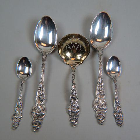 5 pcs. Reed & Barton Sterling Flatware,: "Les Six Fleurs", a sugar sifter (5 1/2"), two tablespoons (7 1/8") and two demitasse spoons (4 1/4"), most monogrammed, 184 grams, excellent.