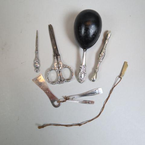 7 pc. Sterling Sewing Items Collection,: includes glove darner, sock darner, scissors, 3 tatting shuttles and hole punch, mostly Victorian.