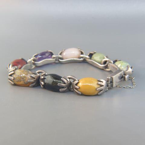 Mexican Sterling & Gemstone Designer Bracelet,: Signed with oval gems including amethyst, agates, onyx and more. 7 1/2" long, 36.1 grams.