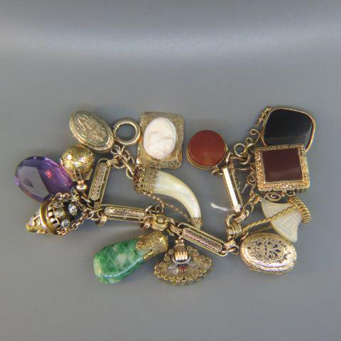 Victorian Gold & Gold-filled Charm Bracelet,: gold-filled long link bracelet with 13 charms including lockets, fobs, amethyst, cameo (in gold), basket and more. 7" long.