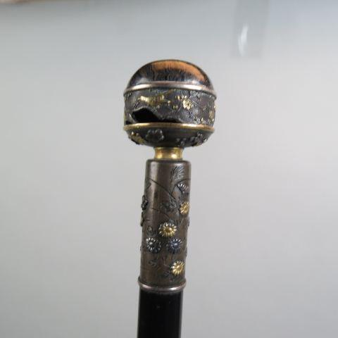 Japanese Meiji Period Walking Stick,: mixed metals, gold, silver & bronze, bird & floral, fine detail, late 19th century, ebony shaft, 35 1/2" long.