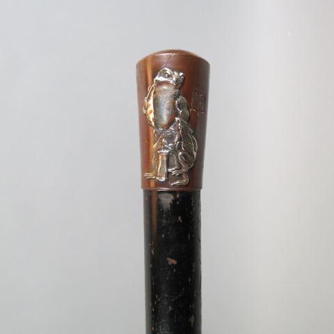 Japanese Mixed Metal Walking Stick,: silver frog, bats & god on copper, black wooden shaft, 35" long.