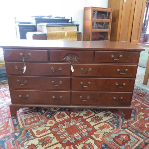 Eldred Wheeler Cherry Chest or Bureau,: 9 drawers, carved fan decor, Chippendale style, 60" wide, 35" tall, 20" deep.