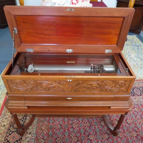1880 Swiss Cylinder Music Box Large Model with Table,: 4 interchangeable 20" cylinders, "Ideal Soprano" model, with Zither attachment, Jacot's pat'd safety check, carved mahogany case 40" X 16" X 13' tall (33" tall on custom made stand), needs some work t