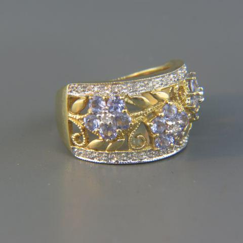 Tanzanite & Diamond 14K Gold Ring,: 15 round gems and 23 round diamond in fancy floral style openwork band setting, 14K yellow gold, 6.4 grams, currently size 6 1/4.