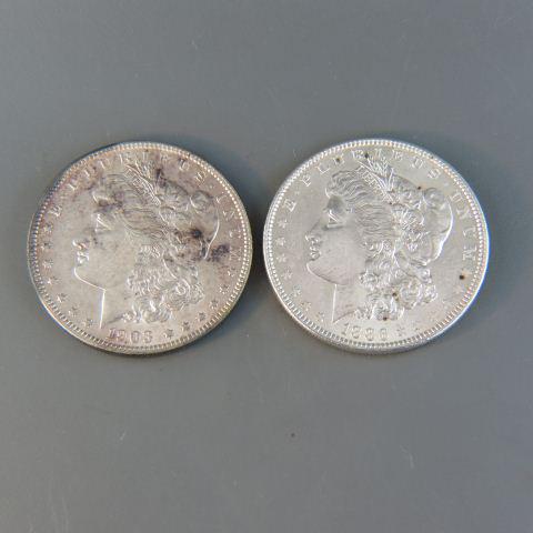 2 Morgan Silver Dollars Uncirculated,: Philadelphia Mint, 1886 & 1903.