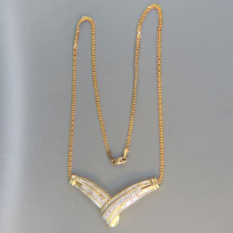 Diamond Necklace with 1 carat of diamonds,: "V" shape pendant loaded with 100 round and baguette diamonds totaling 1 carat in 10K yellow gold, 17 1/2" long, 11.28 grams, with appraisal of $2120.00, 17 3/4" long.
