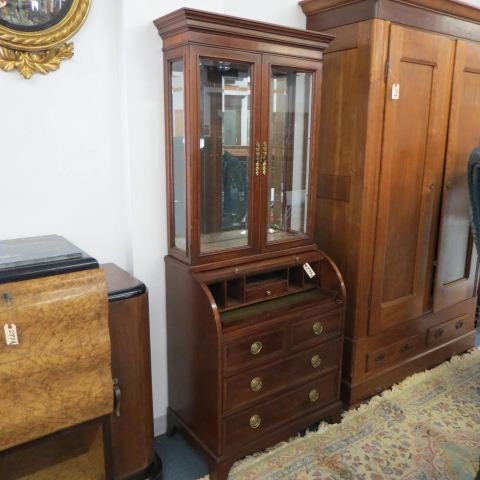 Cherry Secretary Bookcase by Hekman,: drum roll front with inner compartments and drawers, 32" wide, 78" tall, 18" deep, glass shelves.