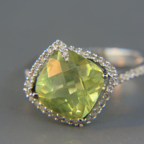 Lemon Citrine & Diamond Ring,: fancy cushion cut gem weighing 5 carats surrounded by round diamonds in 14K white gold, 4.6 grams, currently size 7 1/4.