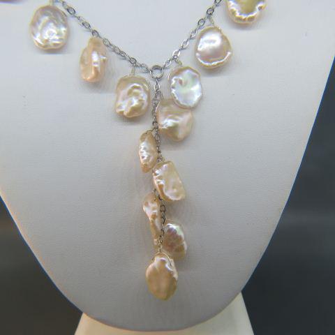 Pearl & Sterling Silver Necklace,: 18 lustrous iridescent scallop shaped dangling pearls, 18" long plus 3" dangle.