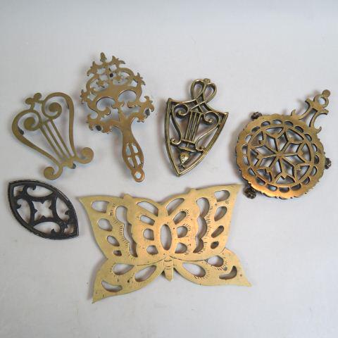6 Antique Trivets,: brass and iron, footed, some 19th century