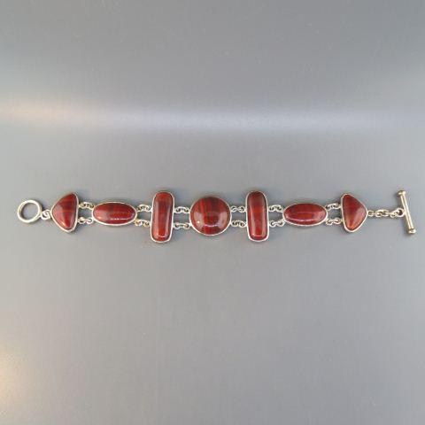 Agate & Sterling Bracelet,: various cabochon brick-red stones, 36 grams, 7 1/2" long.