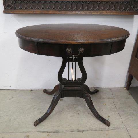 Mahogany Oval Library Table,: Duncan Phyfe base, carved legs, single drawer, 22" X 30" top, 27 1/2" tall.