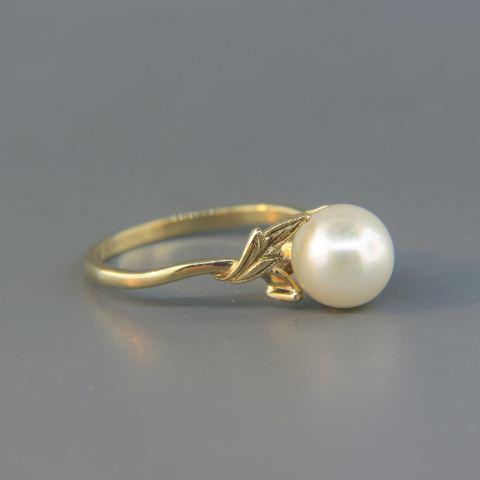 Mikimoto Pearl Ring,: lustrous 7.5mm pearl in 14K yellow gold, signed, currently size 6.