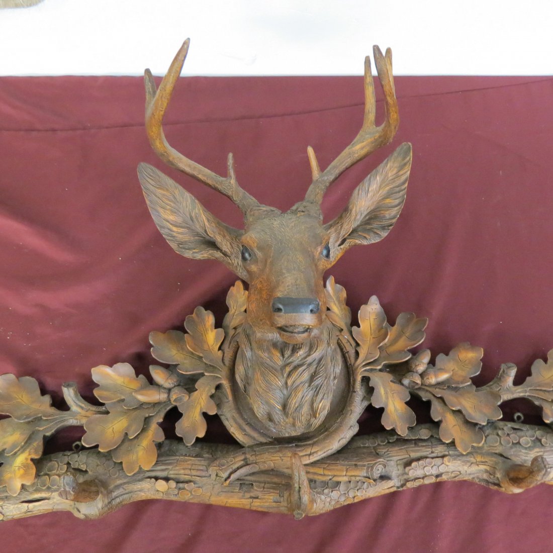 Black Forest Style Wall Coat or Hat Rack,: carved deer head, acorn and oak leaf decor, composition, 40" wide, 18" tall.