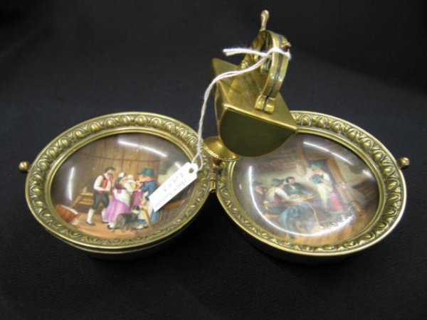 Victorian Cigar Smoking Travel Kit, brass box opens : brass box opens to reveal fine miniature paintings on porcelain and center matchsafe & cigar cutter, 8 1/2" wide when opened.