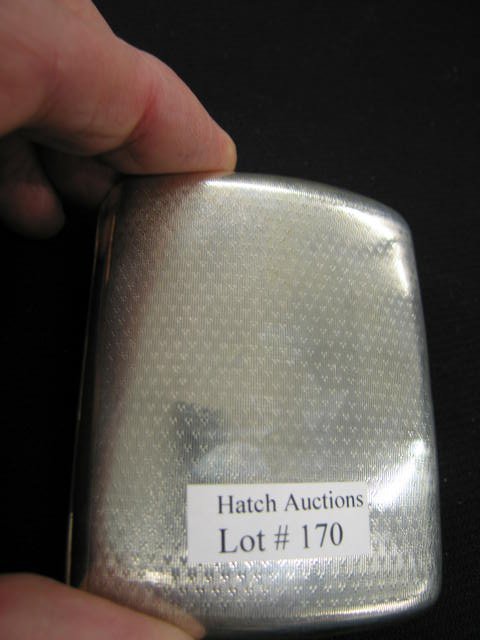 English Sterling Silver Cigarette Case, hallmarked: hallmarked, fine engine turning, shaped for hip, 2 3/4" x 3 3/8".