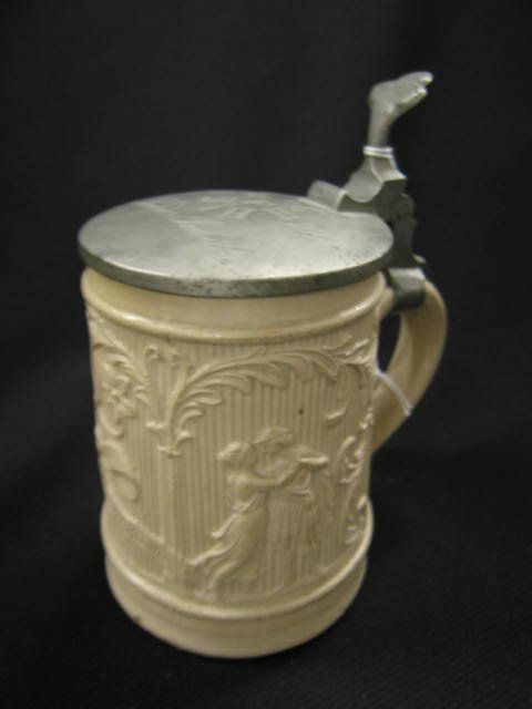 German 1871 Pottery Stein, salt glaze, raised figu: salt glaze, raised figures, 6 1/2", pewter lid, dated on top, excellent.