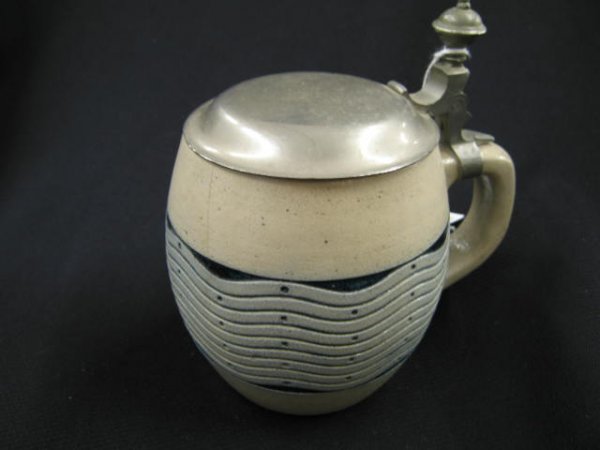 German Pottery Stein, salt-glaze, wave design, 1/2: salt-glaze, wave design, 1/2 liter, 5 3/4", tight hairline.
