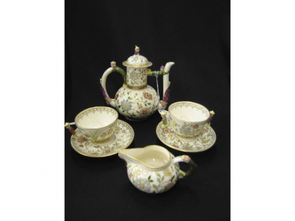 Superb Porcelain Tea Set with Zsolnay style ename: with Zsolnay style enameled floral, figural chinaman handles, 19th century, 6" teapot, creamer , cup & saucer, two handled cup and saucer.
