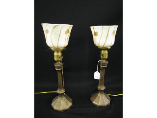 Pair of Art Glass Lamps with Bronzed bases attri: bases attributed to Tiffany, candlestick form, bronze dore textured finish, aurene & calcite Steuben shades with leaf & vine decor, unsigned.