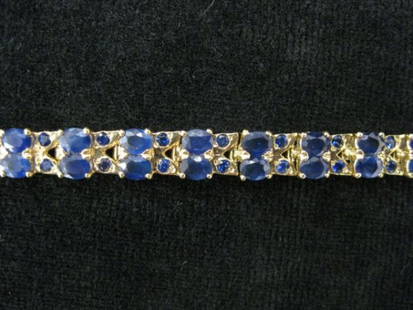 Sapphire Bracelet, round & oval rich blue gems to: round & oval rich blue gems totaling 16 carats in 14k yellow gold, 7 1/2" long, with appraisal of $2000.00