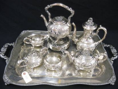 7 pc. Silverplate Tea & Coffee Service, hand-chase: hand-chased floral, footed & handled, 20" x 29" tray, hot water kettle on stand, teapot, coffee pot, sugar, creamer & waste.