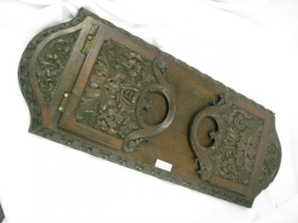 Victorian Carved Wooden Book Rack, deeply carved f: deeply carved foliage, Black Forest type, 8 1/2" x 22", circa 1890.