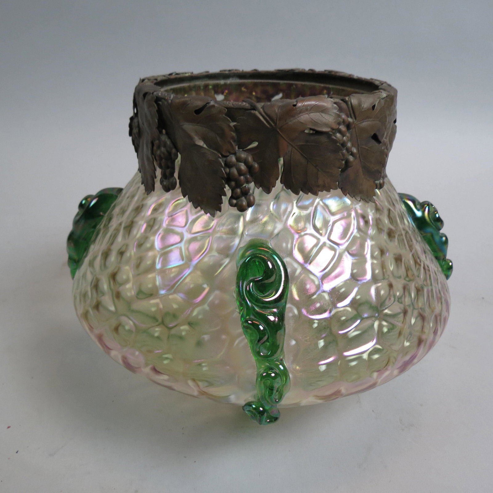 Loetz Austria Art Glass Vase,: iridescent textured background with four green applied coils, grape and vine copper collar, 9 3/4" diameter, 6 3/4" tall, unsigned.........Loetz was the premier Bohemian art glass manufacturer during 