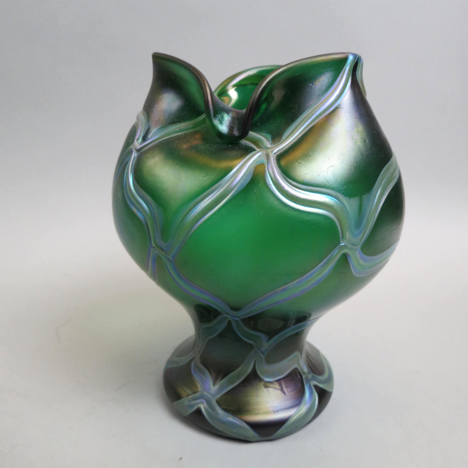 Loetz Type Austrian Art Glass Vase,: iridescent trailing vine on green flora form body, 8 1/2", excellent.