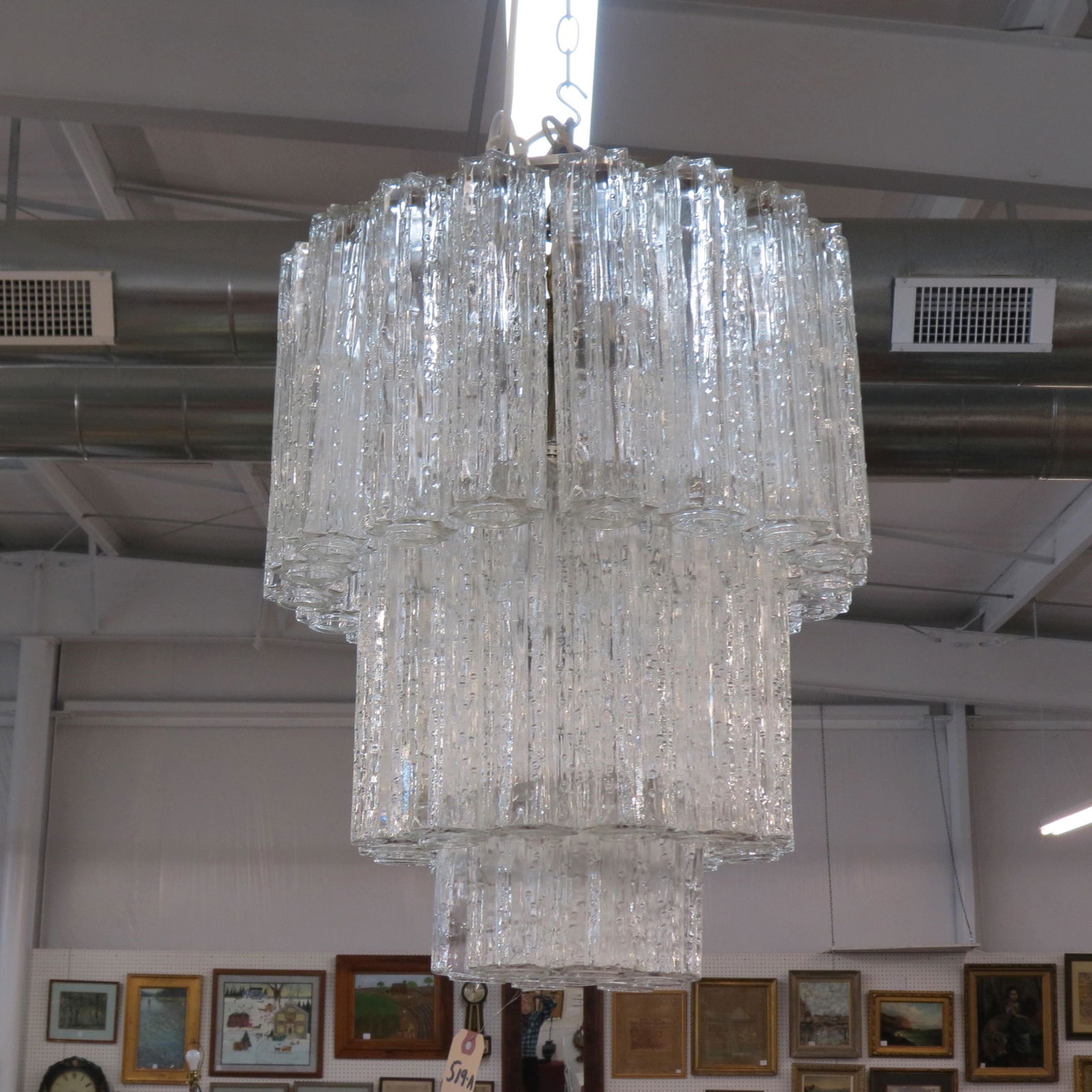 Italian Glass Chandelier,: triple tier with textured glass cylinders, attributed to Timo Sarpaneva, approx 18" diameter, 21" tall, one cylinder chipped.