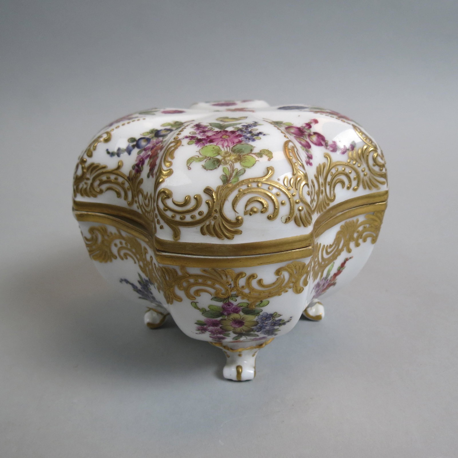Meissen Porcelain Footed Box,: Handpainted floral designs and heavy gold work, lift off top, 5" across, 4" tall, crossed swords mark, excellent.
