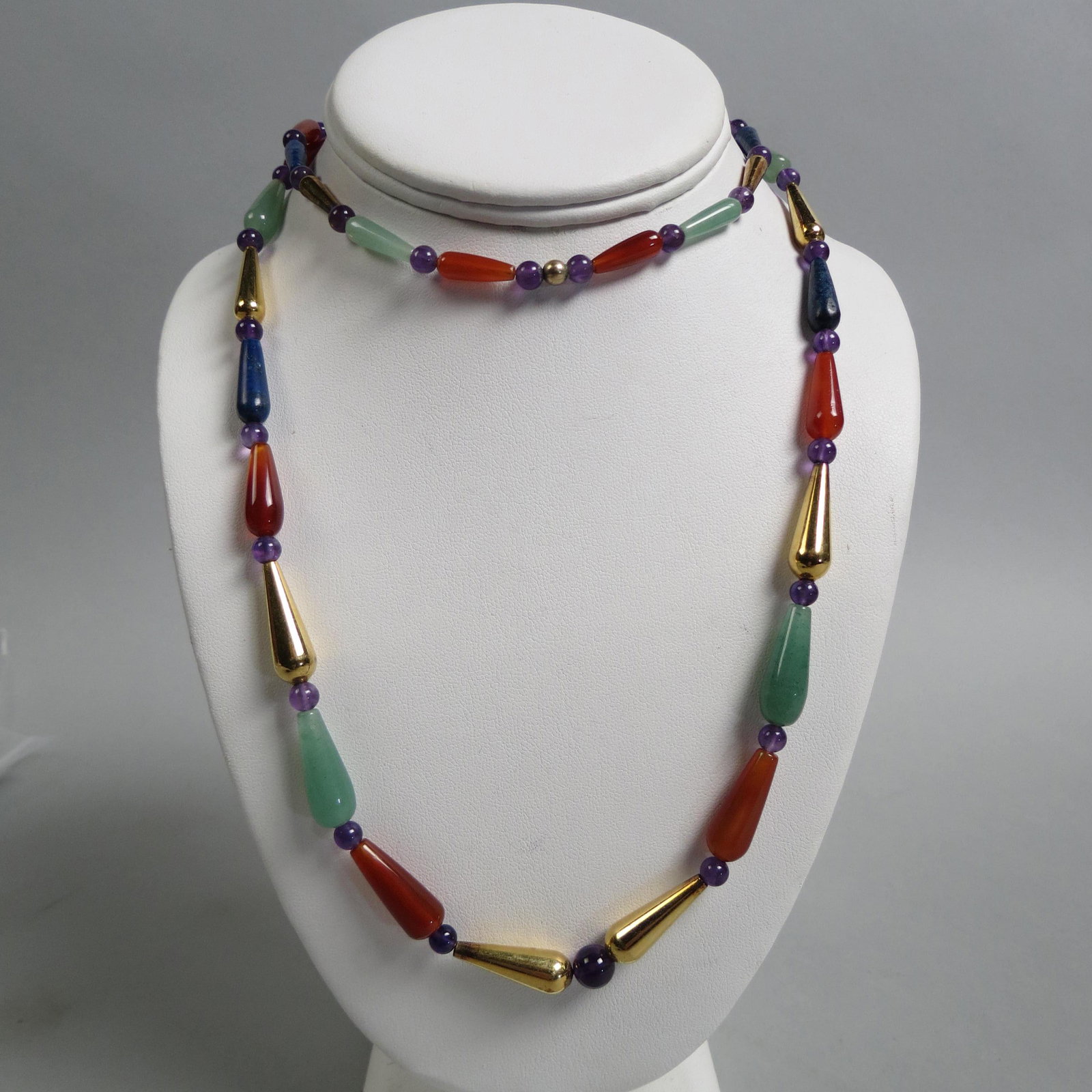 Gemstone Bead Necklace,: teardrop shape lapis, carnelian and more with round amethyst beads and gold finish beads, 32" long.